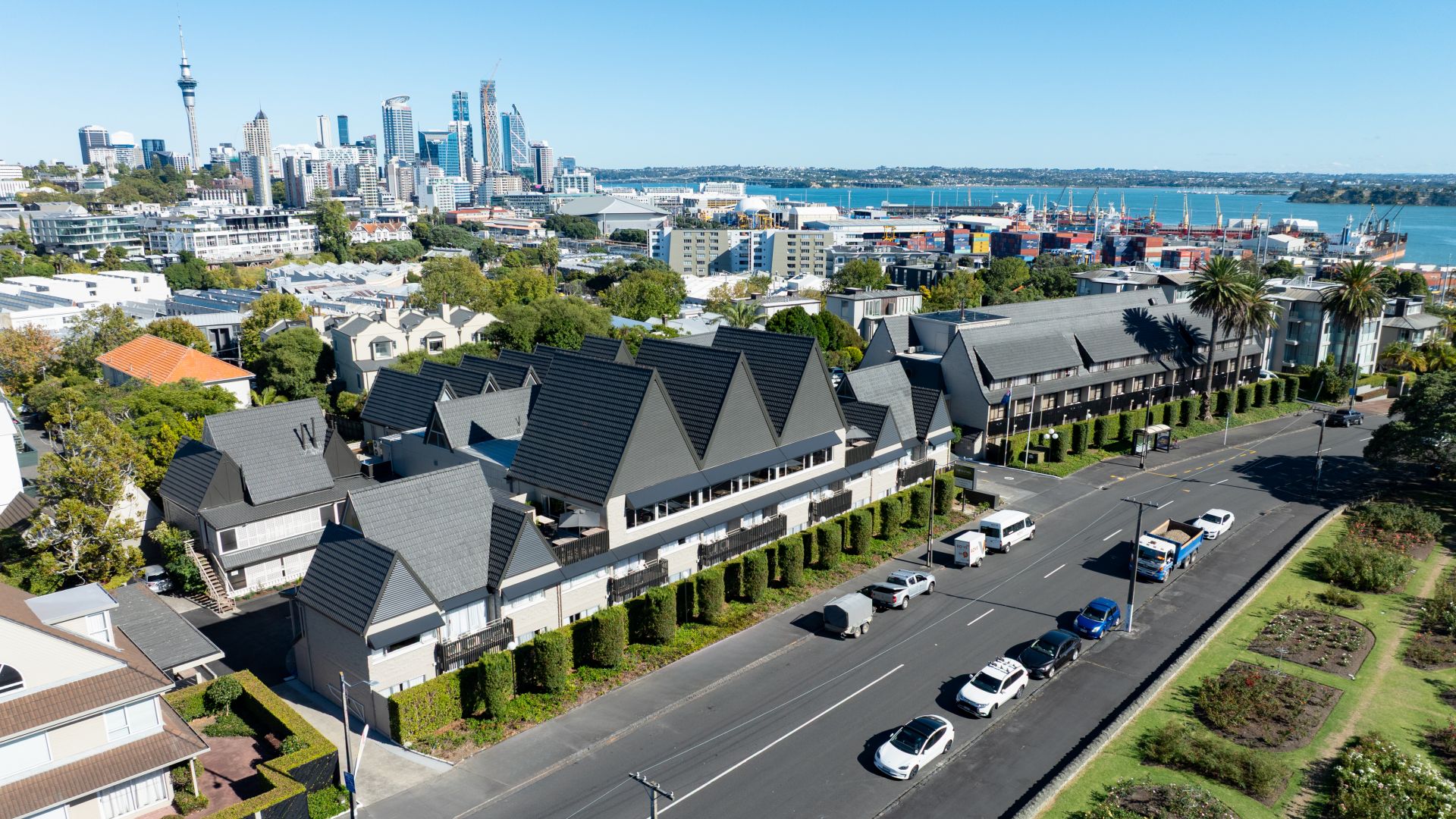 Aerial view of Rose Park Hotel Auckland, a boutique accommodation in Auckland, with views of Spark Arena, the harbour and CBD in the background.